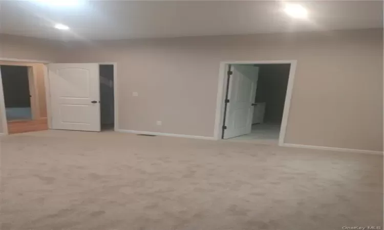 Empty room with carpet flooring