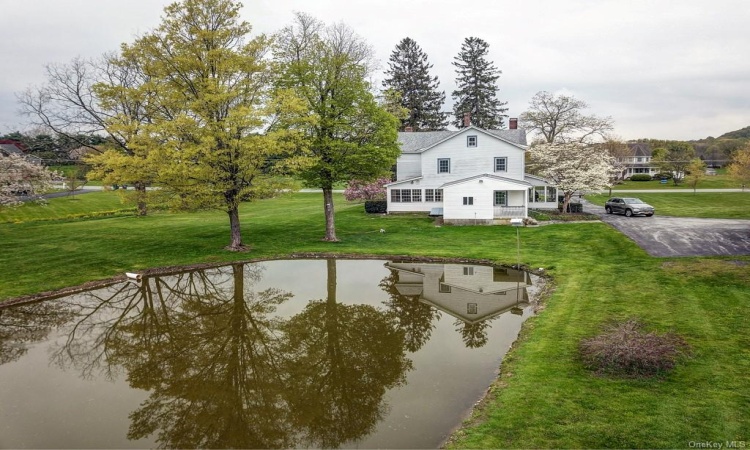 Man made pond in the back yard just enhances the serenity of the property.