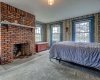 Full brick working fireplace in spacious master bedroom.  Note all of the natural light from large windows, to once again enjoy the gorgeous views.