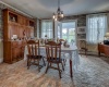 Spacious formal dining room with door to side porch.  Hardwood floors underneath carpet, as in most of the downstairs rooms.