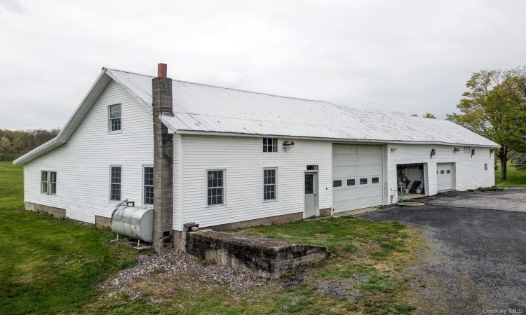 45' X 90' barn with oversized garage bays, storage  areas, barn area and walkup attic