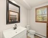 Powder Room with a window and Laundry closet