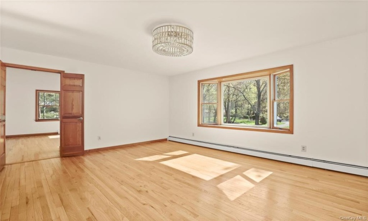 Formal Dining room with a Bay window and doors to Family Room