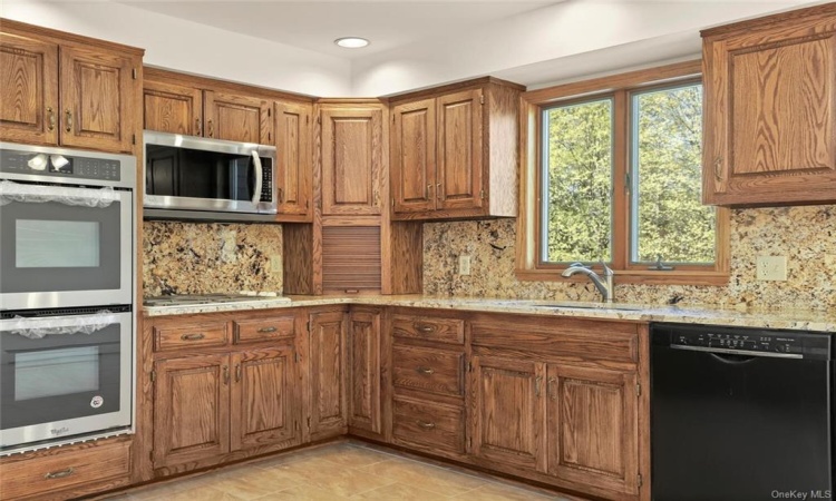 No need to get frantic in this Kitchen, with new double oven, new dishwasher, new microwave and refrigerator  with ice/water dispenser. ! And let's not forget the beautiful 4 burner gas cooktop.