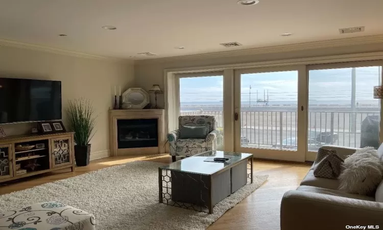 living room with Ocean Views, fireplace & terrace