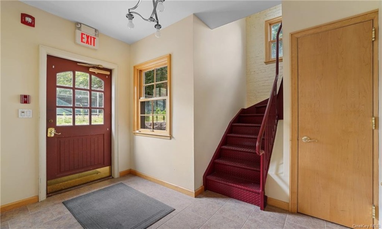 Spacious entrance hall with store room