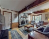 Formal living/sitting area with woodburning fireplace.