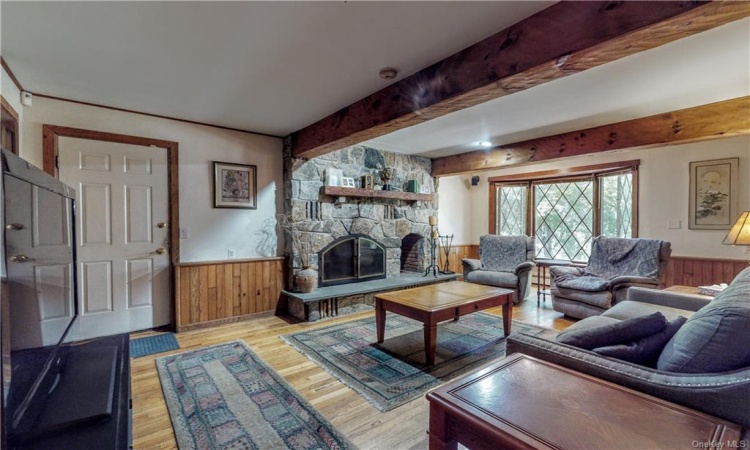 Formal living/sitting area with woodburning fireplace.