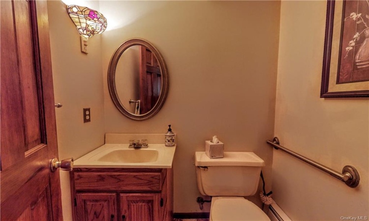 Half bath powder room is perfect for guests.