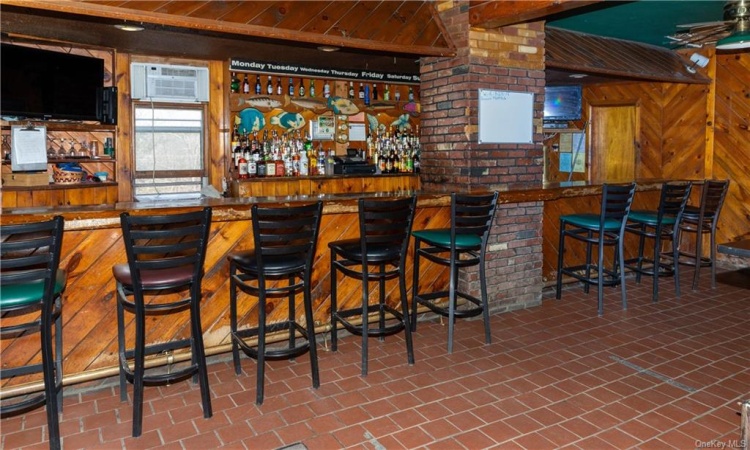 Seated at the bar, one has view of the river from the windows.