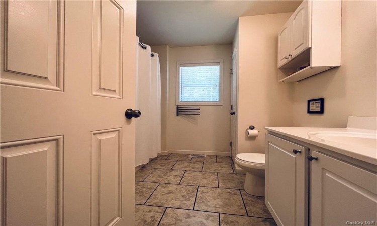 Full bathroom with tub and shower.