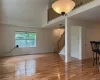 Featuring high vaulted ceiling and hardwood flooring