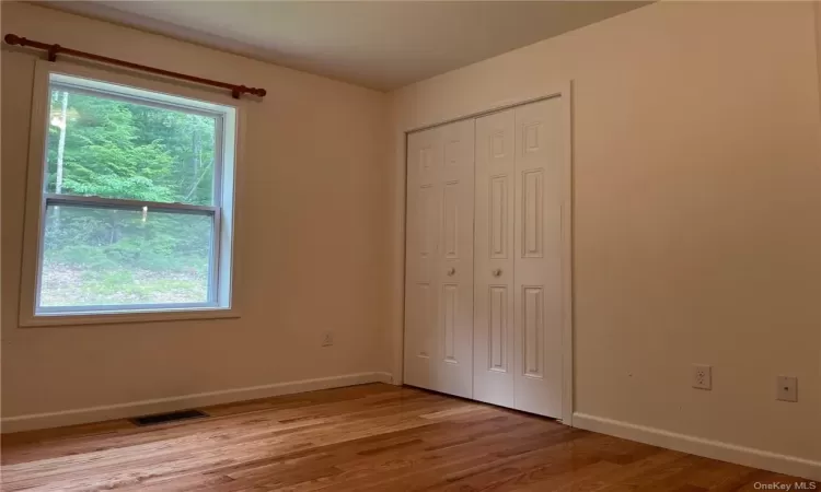 Bedroom featuring hardwood flooring