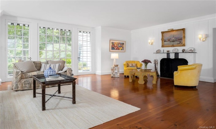 Second seating area in the  living room showcasing the hand carved marble fireplace