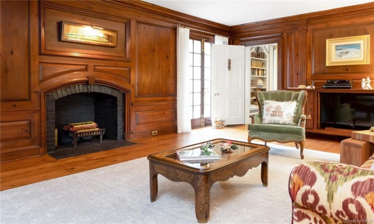 Den/family  room  w/original heart pine panelling and three access ways to the outdoors