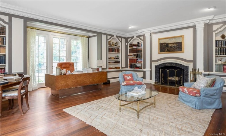 Over-sized Library/office w/fireplace and French doors to the gardens