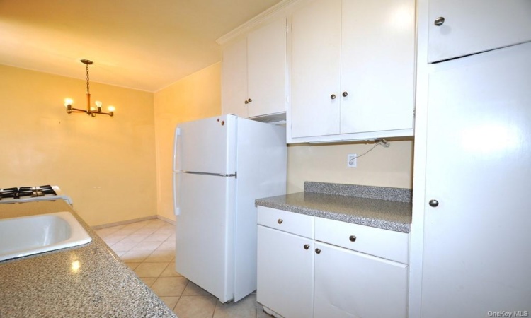 Eat-in Kitchen has plenty of cabinetry and counter space.