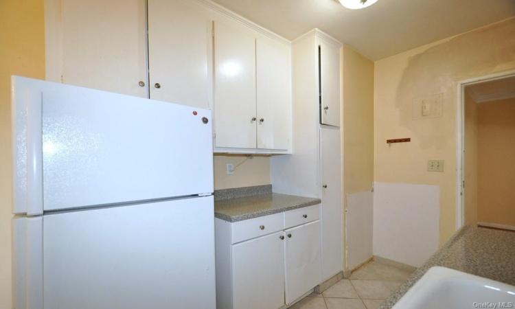 Eat-in Kitchen has plenty of cabinetry and counter space.