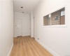 Reception area with view of doors to lab area and patient exam room / private office.