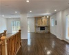 MAIN LEVEL OPEN CONCEPT LIVING AREA WITH FIREPLACE AND TV MOUNT ABOVE