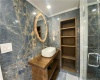 MASTER ENSUITE WITH CUSTOM WOOD SINK AND BUILT IN