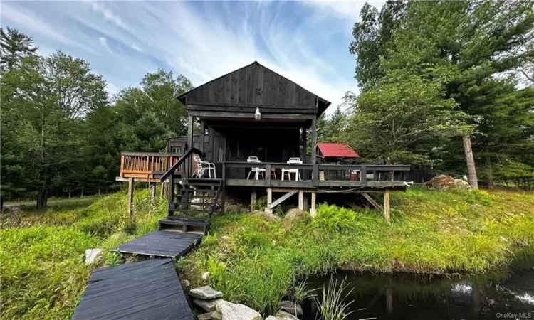 Back of house featuring a deck