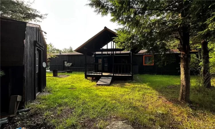 View of yard with a wooden deck