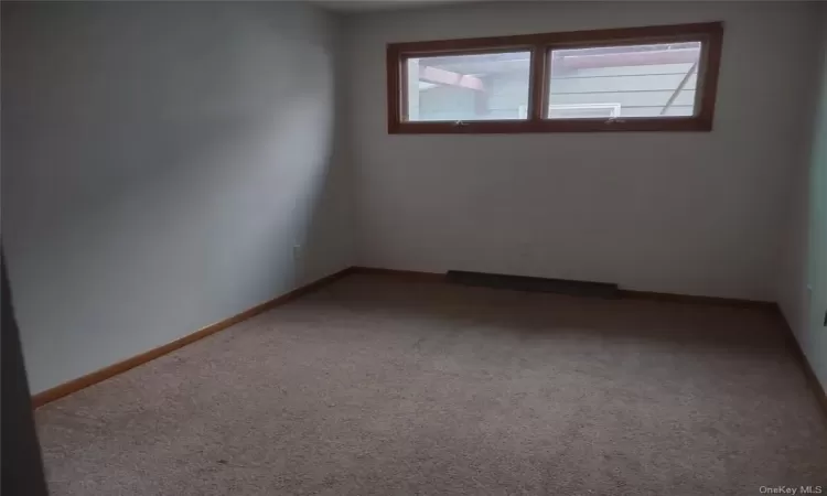 Spare room featuring carpet floors