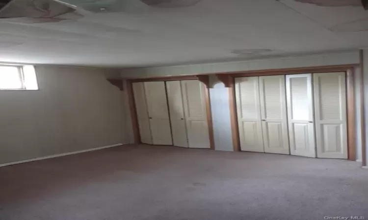 Unfurnished bedroom featuring carpet floors