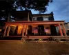 View of front of house with a porch and a balcony