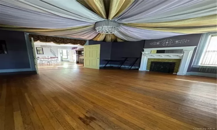 Unfurnished living room with wood-type flooring