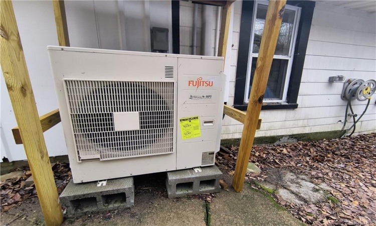 Powerful Fujitsu heating/AC split unit (behind home).