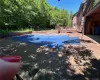 View of swimming pool featuring a wooden deck