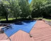 View of swimming pool with a deck