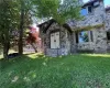 View of front of property featuring a front yard