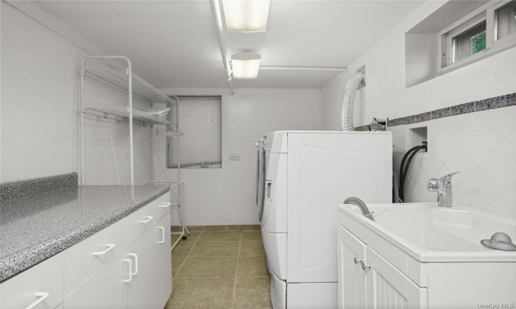 Private laundry room in finished basement.