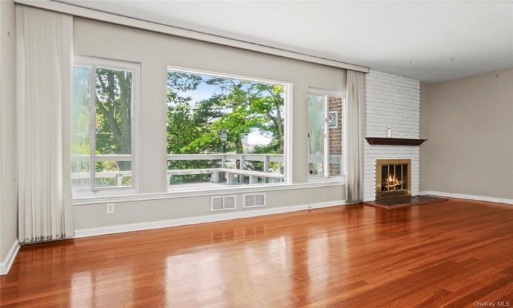 Living room with large picture windows - view to your own private oasis.