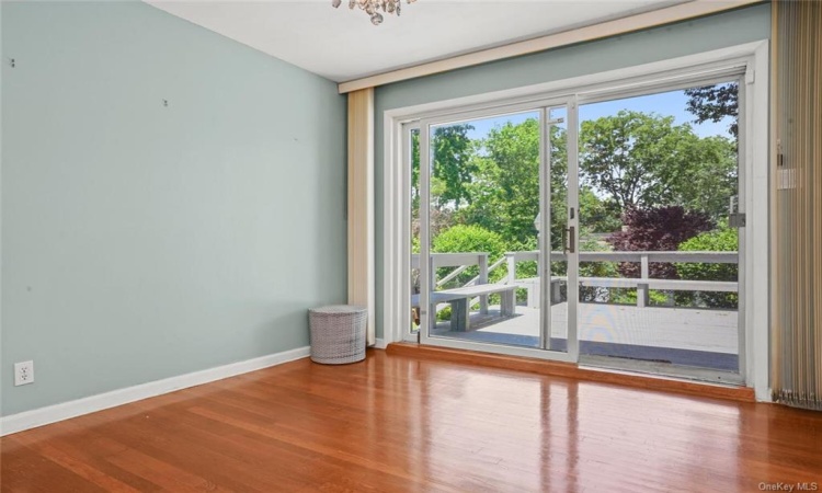 Formal dining area with sliding glass door to deck.