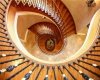 This dramatic view of the stairs that start in the garden level and continue up two floors.