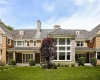 Back view of  great rooms floor to ceiling windows