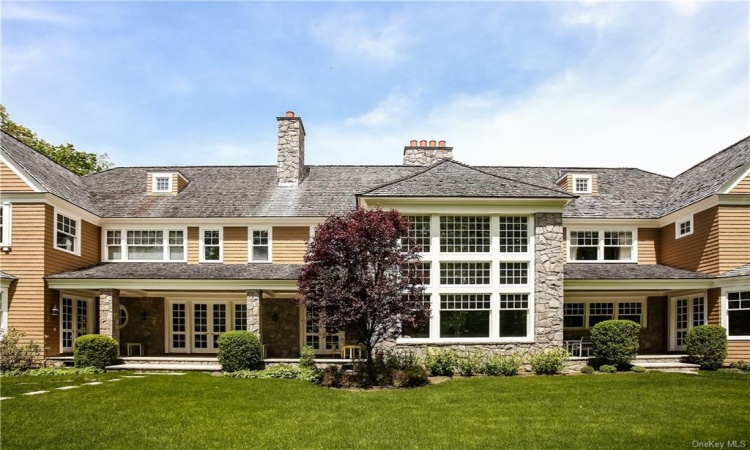 Back view of  great rooms floor to ceiling windows