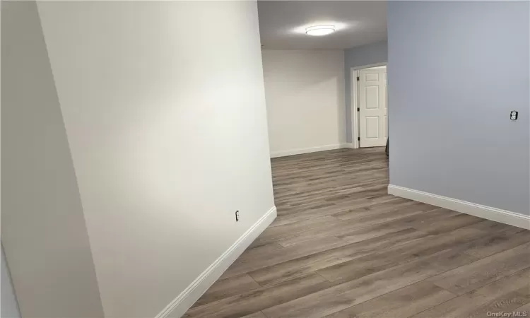 Corridor featuring hardwood / wood-style floors