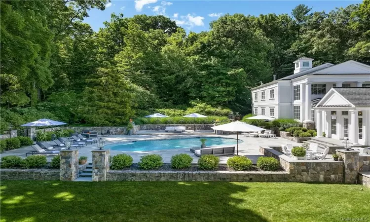 View of pool featuring a yard and a patio area