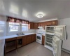 Apt. B.  Updated kitchen with electric oven/range and refrigerator.  800 sqft.