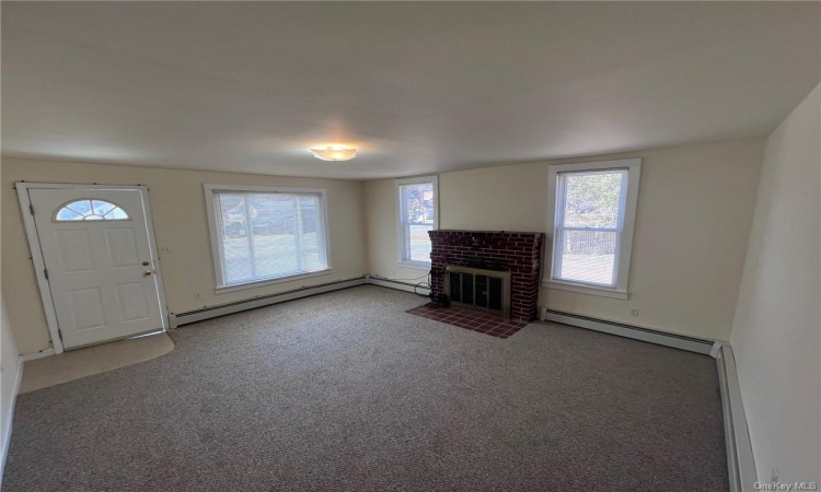 Apt A.  Fireplace, natural light, access from front porch.