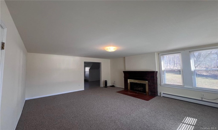 Apt. B also features a fireplace and large living room with coat closet.