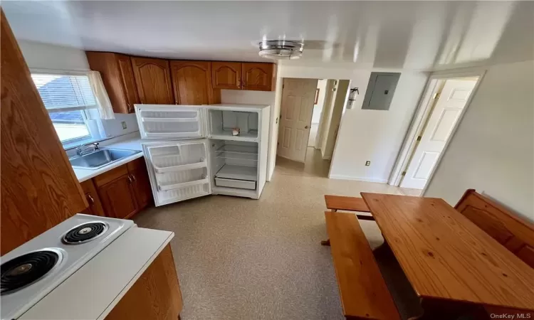 Apt C.  Eat in kitchen.  Electric oven/range and refrigerator.