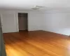 Unfurnished bedroom featuring a closet, vaulted ceiling, and light hardwood / wood-style flooring