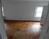 Unfurnished room featuring a textured ceiling and hardwood / wood-style flooring