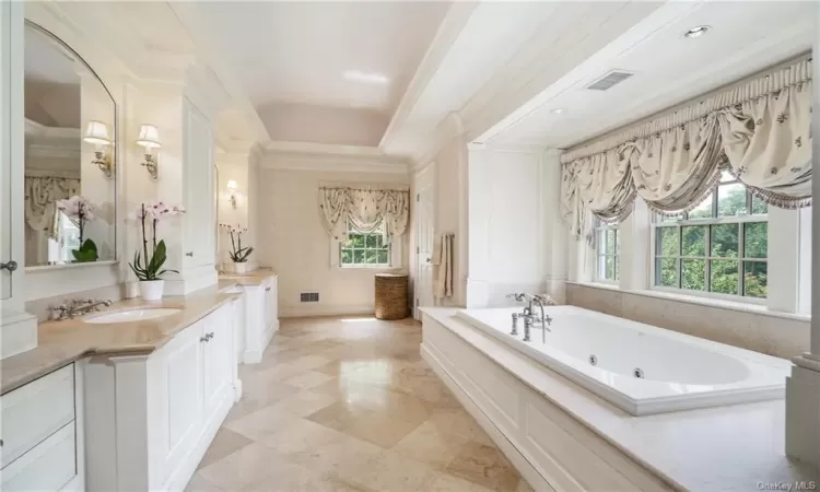 Primary Limestone Bathroom with Steam Shower, Double Sinks, Extra Large Jacuzzi and Separate Toilet Room.